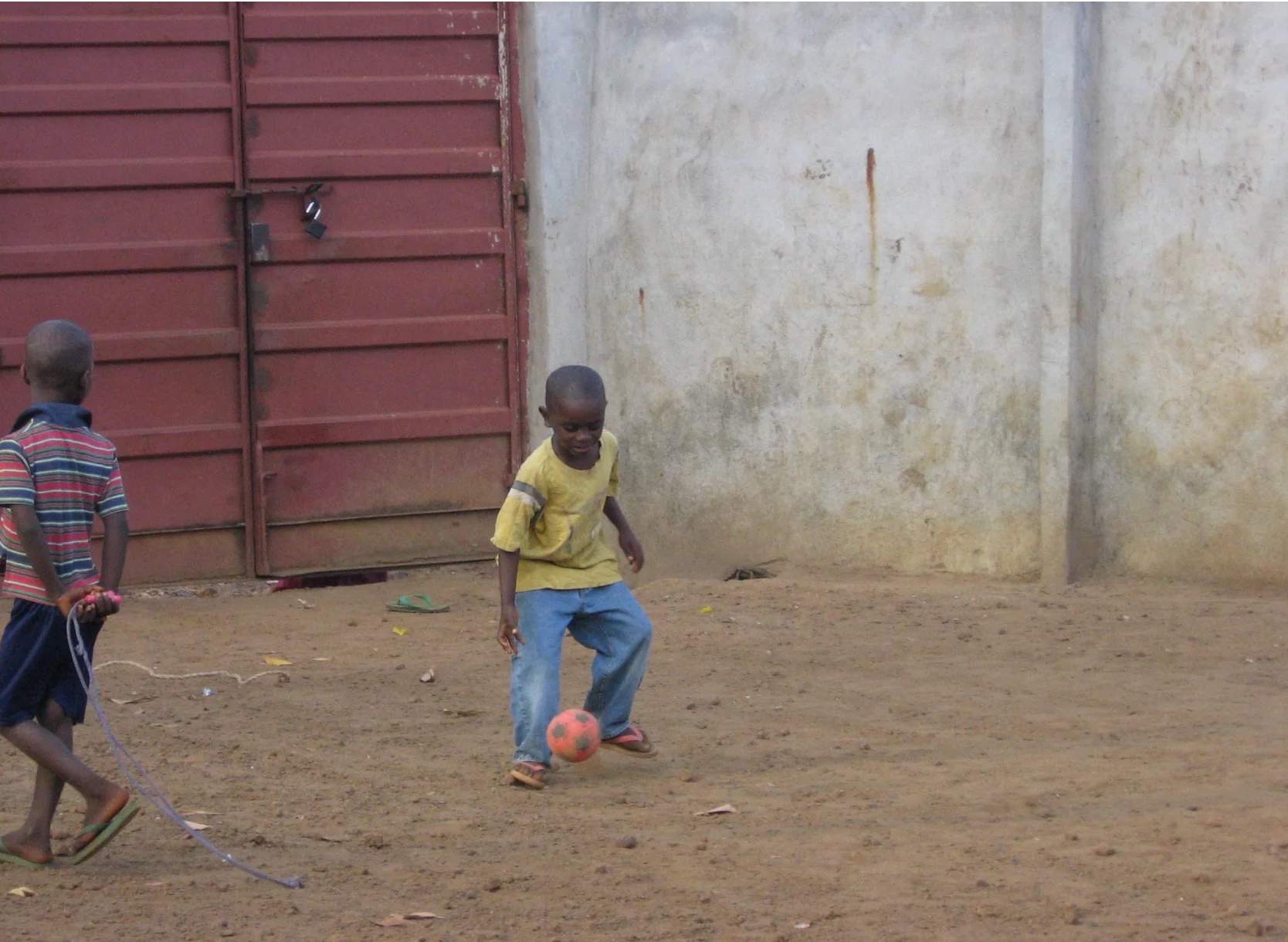ABU, founder of ANORE, playing football as a young boy in Sierra Leone